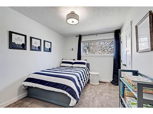 5907 Lockinvar Road Sw, Calgary, AB - Indoor Photo Showing Bedroom