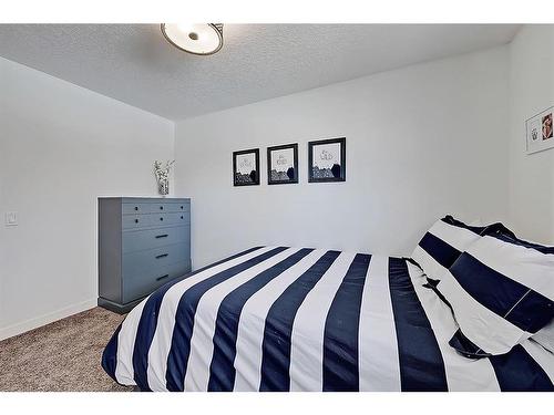 5907 Lockinvar Road Sw, Calgary, AB - Indoor Photo Showing Bedroom