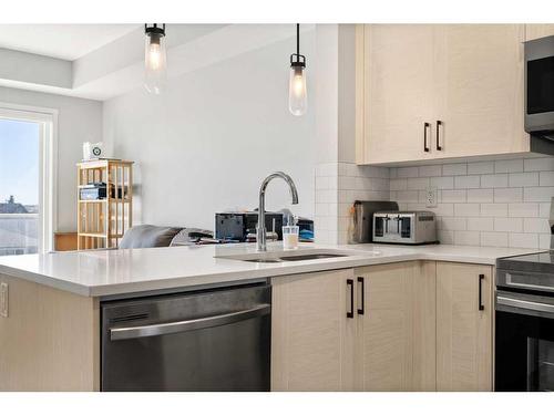 303-100 Harvest Hills Place Ne, Calgary, AB - Indoor Photo Showing Kitchen With Double Sink With Upgraded Kitchen