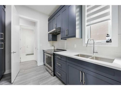 90 Trinity Road, Rural Rocky View County, AB - Indoor Photo Showing Kitchen With Double Sink With Upgraded Kitchen