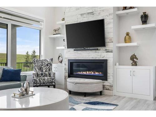 90 Trinity Road, Rural Rocky View County, AB - Indoor Photo Showing Living Room With Fireplace