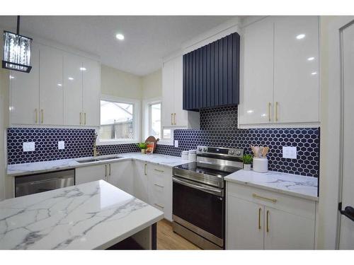 113 W Creek Boulevard, Chestermere, AB - Indoor Photo Showing Kitchen With Double Sink