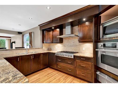 20 Hallmark Place Sw, Calgary, AB - Indoor Photo Showing Kitchen With Double Sink With Upgraded Kitchen