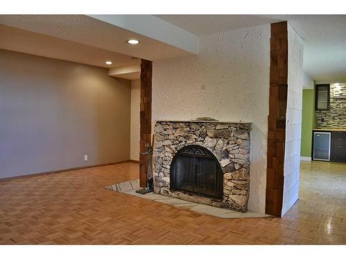 1165 Hunterston Hill Nw, Calgary, AB - Indoor Photo Showing Other Room With Fireplace