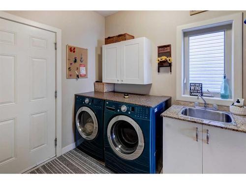 16 Sunset Close, Cochrane, AB - Indoor Photo Showing Laundry Room