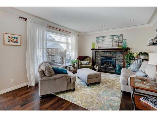 16 Sunset Close, Cochrane, AB - Indoor Photo Showing Living Room With Fireplace