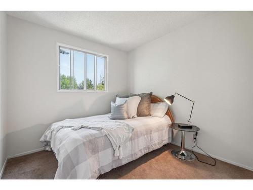 96 Millcrest Way Sw, Calgary, AB - Indoor Photo Showing Bedroom