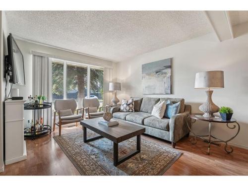 96 Millcrest Way Sw, Calgary, AB - Indoor Photo Showing Living Room