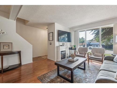 96 Millcrest Way Sw, Calgary, AB - Indoor Photo Showing Living Room