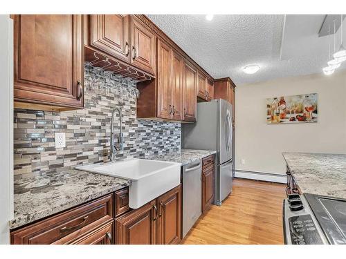 221-820 89 Avenue Sw, Calgary, AB - Indoor Photo Showing Kitchen With Upgraded Kitchen