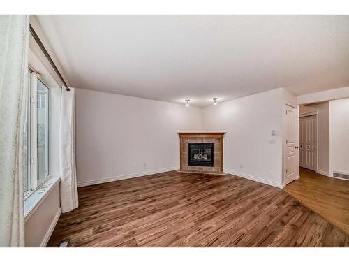 62 Royal Birch Gardens Nw, Calgary, AB - Indoor Photo Showing Living Room With Fireplace