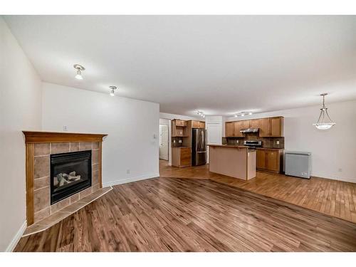 62 Royal Birch Gardens Nw, Calgary, AB - Indoor With Fireplace