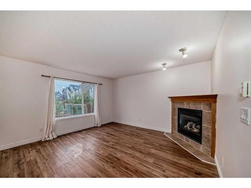 62 Royal Birch Gardens Nw, Calgary, AB - Indoor Photo Showing Living Room With Fireplace