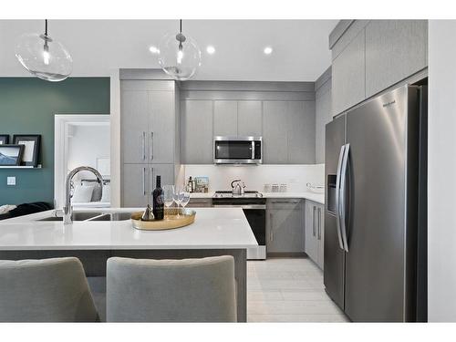 2215-395 Skyview Parkway Ne, Calgary, AB - Indoor Photo Showing Kitchen With Stainless Steel Kitchen With Double Sink With Upgraded Kitchen