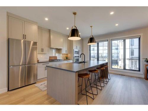 34-130 Discovery Drive Sw, Calgary, AB - Indoor Photo Showing Kitchen With Fireplace