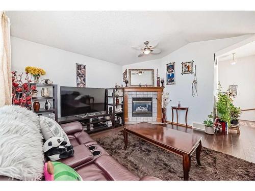 7281 Laguna Way Ne, Calgary, AB - Indoor Photo Showing Living Room With Fireplace