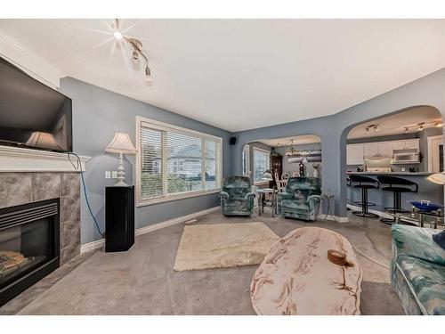 112 Oakmere Place, Chestermere, AB - Indoor Photo Showing Living Room With Fireplace