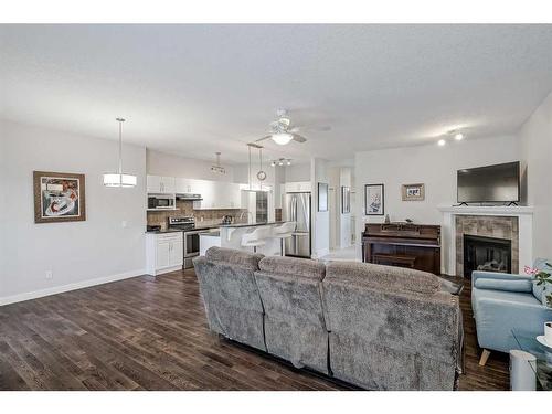 103 Bridle Estates Mews Sw, Calgary, AB - Indoor Photo Showing Living Room With Fireplace