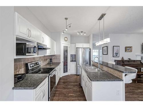 103 Bridle Estates Mews Sw, Calgary, AB - Indoor Photo Showing Kitchen With Stainless Steel Kitchen With Double Sink With Upgraded Kitchen