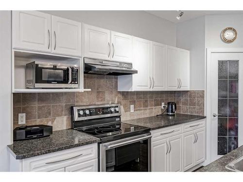 103 Bridle Estates Mews Sw, Calgary, AB - Indoor Photo Showing Kitchen With Upgraded Kitchen