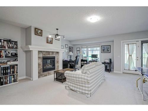 103 Bridle Estates Mews Sw, Calgary, AB - Indoor Photo Showing Living Room With Fireplace