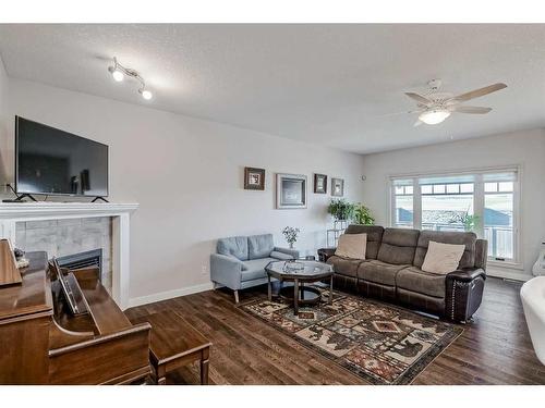 103 Bridle Estates Mews Sw, Calgary, AB - Indoor Photo Showing Living Room With Fireplace