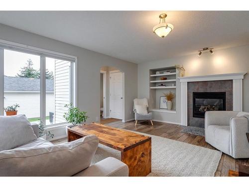 7967 Wentworth Drive Sw, Calgary, AB - Indoor Photo Showing Living Room With Fireplace