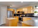 7967 Wentworth Drive Sw, Calgary, AB  - Indoor Photo Showing Kitchen With Double Sink 