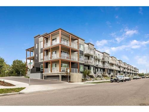 107-1605 17 Street Se, Calgary, AB - Outdoor With Facade