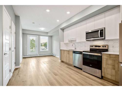 107-1605 17 Street Se, Calgary, AB - Indoor Photo Showing Kitchen With Stainless Steel Kitchen With Upgraded Kitchen