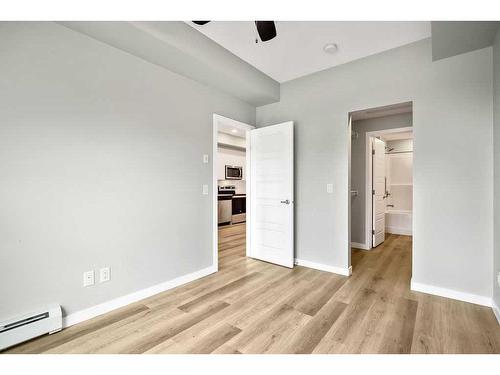 107-1605 17 Street Se, Calgary, AB - Indoor Photo Showing Other Room