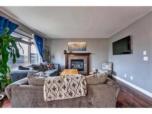 65 Evansdale Landing Nw, Calgary, AB - Indoor Photo Showing Living Room With Fireplace