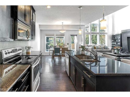 100 Cranridge Crescent Se, Calgary, AB - Indoor Photo Showing Kitchen With Double Sink With Upgraded Kitchen