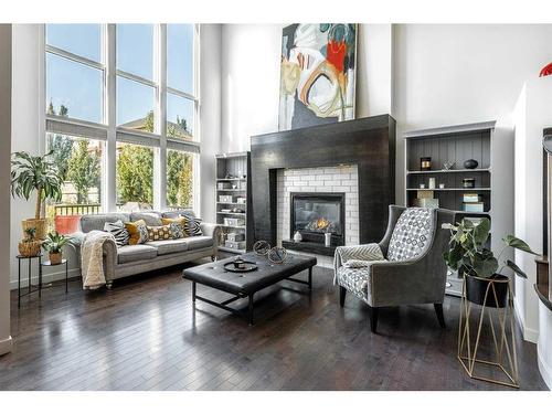 100 Cranridge Crescent Se, Calgary, AB - Indoor Photo Showing Living Room With Fireplace