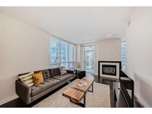 514-222 Riverfront Avenue Sw, Calgary, AB - Indoor Photo Showing Living Room With Fireplace