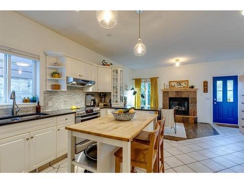 1633 18 Avenue Nw, Calgary, AB - Indoor Photo Showing Other Room With Fireplace