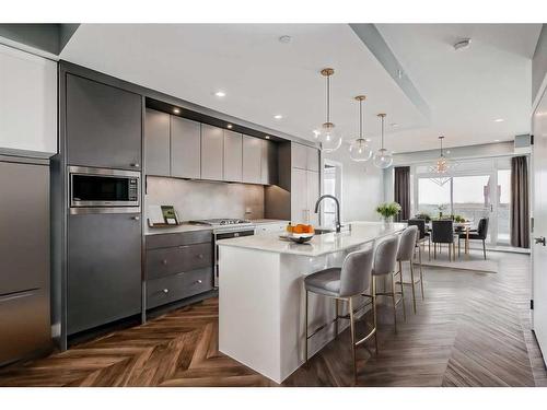 410-8445 Broadcast Avenue Sw, Calgary, AB - Indoor Photo Showing Kitchen With Upgraded Kitchen