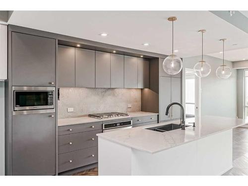 410-8445 Broadcast Avenue Sw, Calgary, AB - Indoor Photo Showing Kitchen With Double Sink With Upgraded Kitchen