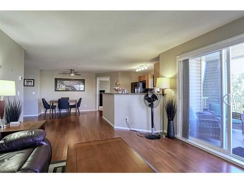 2226-10 Prestwick Bay Se, Calgary, AB - Indoor Photo Showing Living Room