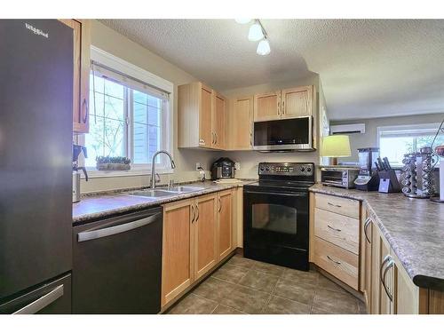 2226-10 Prestwick Bay Se, Calgary, AB - Indoor Photo Showing Kitchen With Double Sink