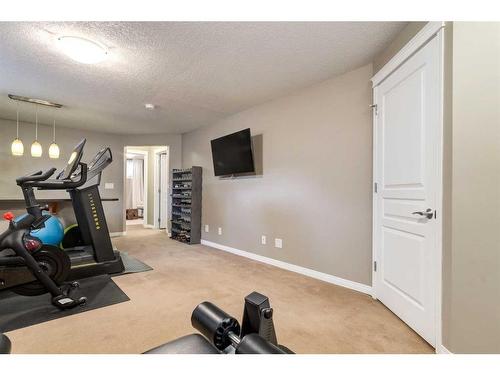 41 New Brighton Heights Se, Calgary, AB - Indoor Photo Showing Gym Room