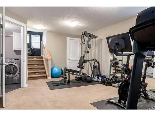 41 New Brighton Heights Se, Calgary, AB - Indoor Photo Showing Gym Room