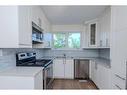 301 Fonda Way Se, Calgary, AB  - Indoor Photo Showing Kitchen With Stainless Steel Kitchen With Double Sink 