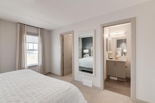 83 Heirloom Boulevard Se, Calgary, AB - Indoor Photo Showing Bedroom