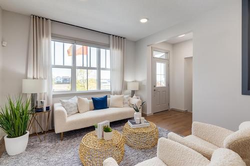 83 Heirloom Boulevard Se, Calgary, AB - Indoor Photo Showing Living Room