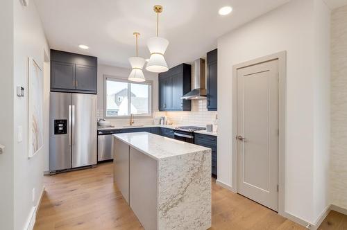 83 Heirloom Boulevard Se, Calgary, AB - Indoor Photo Showing Kitchen With Upgraded Kitchen