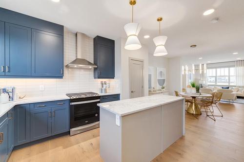 83 Heirloom Boulevard Se, Calgary, AB - Indoor Photo Showing Kitchen With Upgraded Kitchen