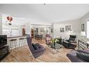 110-1415 17 Street Se, Calgary, AB  - Indoor Photo Showing Living Room 