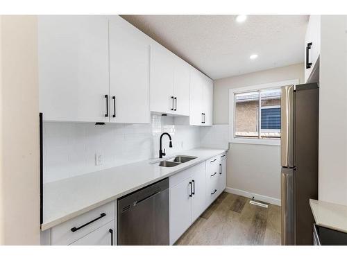 3624 67 Street Nw, Calgary, AB - Indoor Photo Showing Kitchen With Double Sink