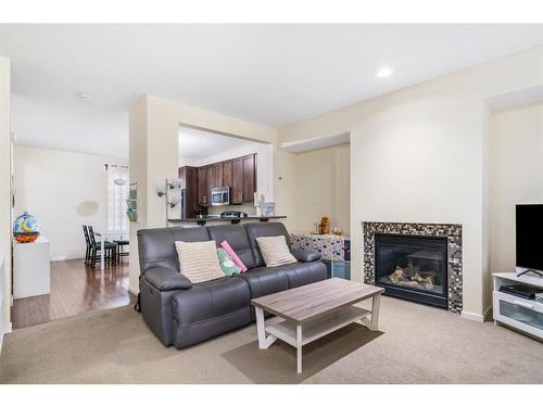 125 Chapalina Square Se, Calgary, AB - Indoor Photo Showing Living Room With Fireplace